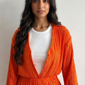 a model wears a casual orange , plesse by jawaher