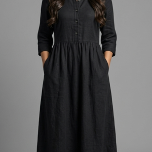 a model wears a black dress freedom dress from jawaher